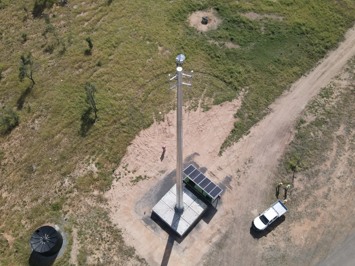 Aerial view of a solar-powered monopole tower build